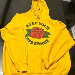 It’s gold colored sweater and it’s in perfect condition